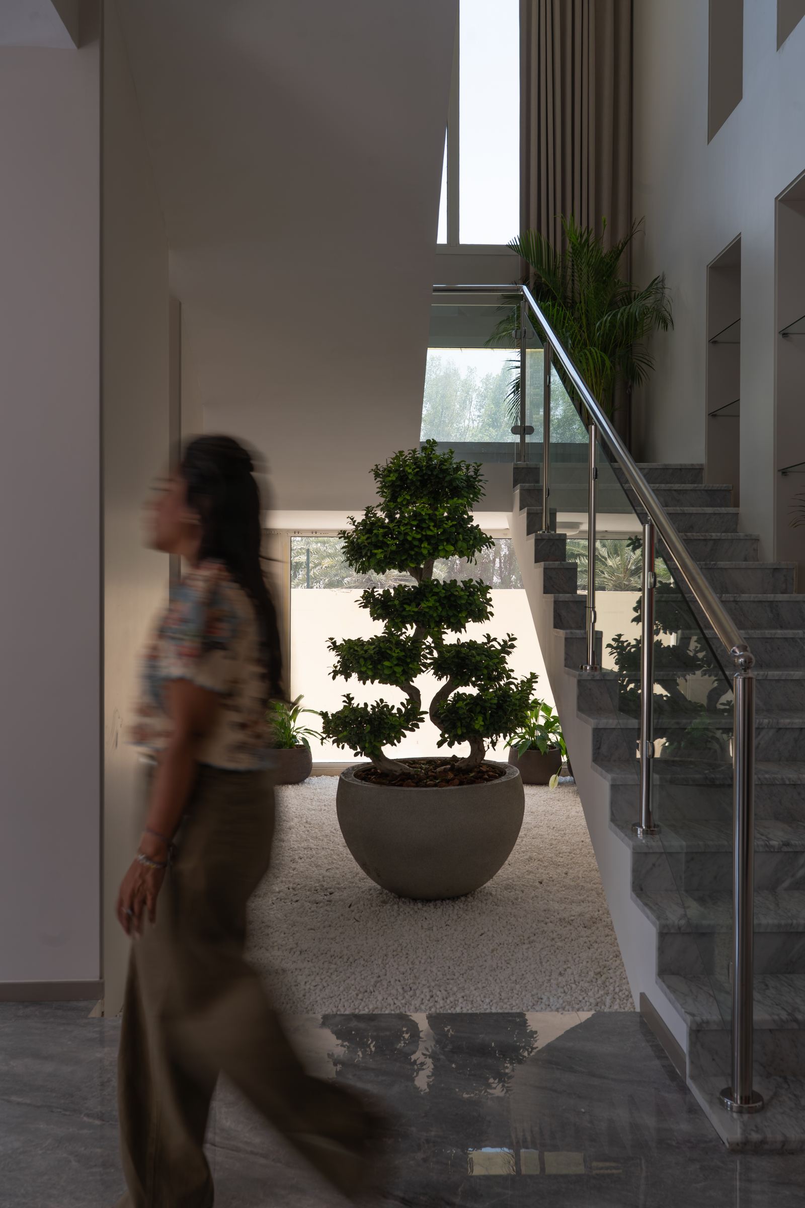 Aleena walking through a designed interior